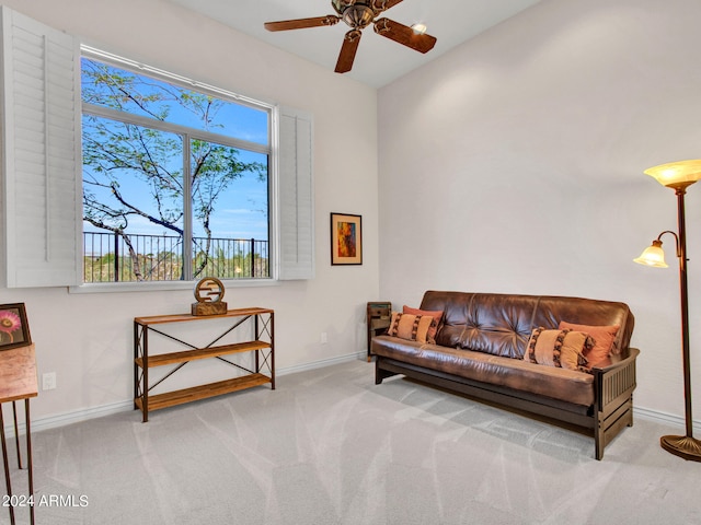 sitting room with light carpet and ceiling fan