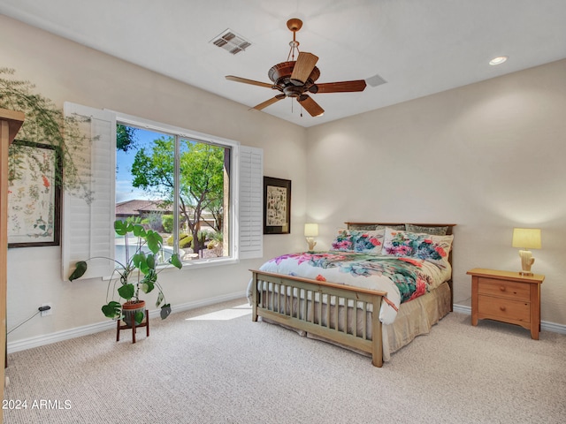 bedroom featuring ceiling fan and light carpet