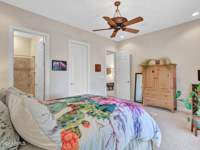 carpeted bedroom featuring connected bathroom and ceiling fan