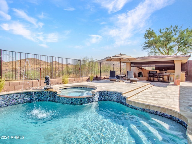 view of pool featuring a patio and an in ground hot tub