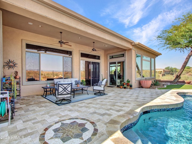 exterior space featuring a patio, outdoor lounge area, and ceiling fan