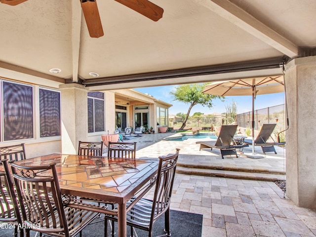 3220 W Feather Sound Dr, Anthem, AZ 85086 - view of patio / terrace featuring outdoor dining space, an outdoor pool, fence, and ceiling fan