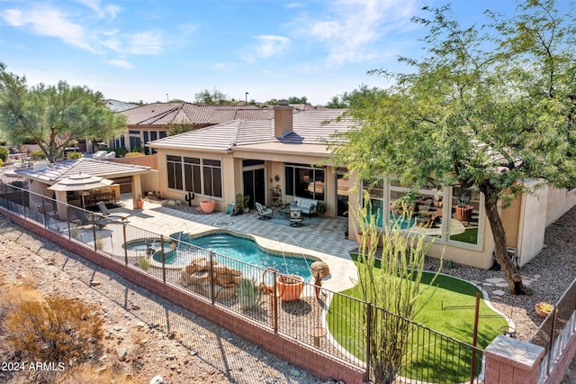 view of pool with a patio and a lawn