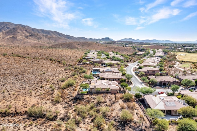 birds eye view of property featuring a mountain view