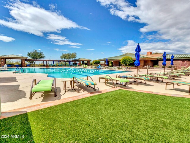 3220 W Feather Sound Dr, Anthem, AZ 85086 - community pool featuring a gazebo, a patio area, and a yard
