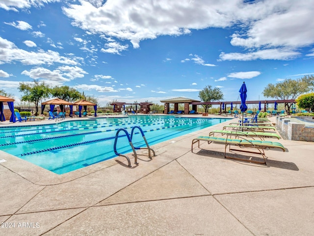 3220 W Feather Sound Dr, Anthem, AZ 85086 - community pool with a patio area and a gazebo