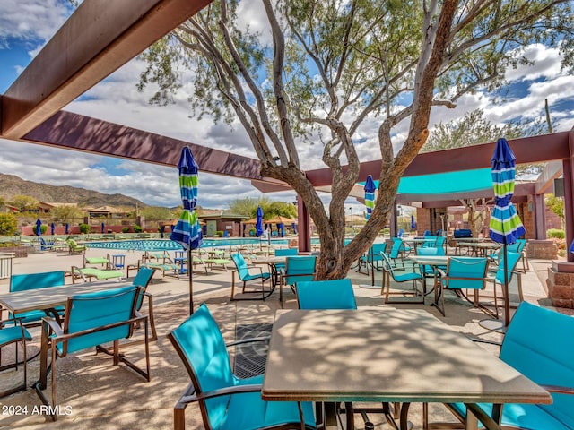 3220 W Feather Sound Dr, Anthem, AZ 85086 - view of patio with outdoor dining space and a mountain view