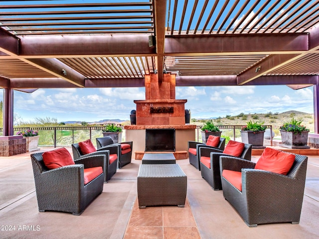 view of patio / terrace featuring a pergola, an outdoor living space, and a mountain view