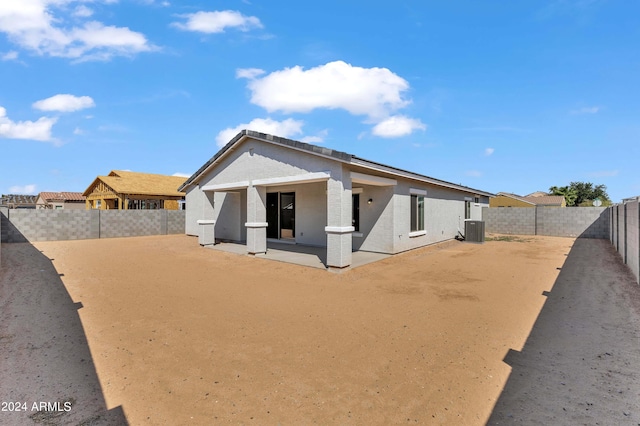 view of front of house with a patio and central AC unit