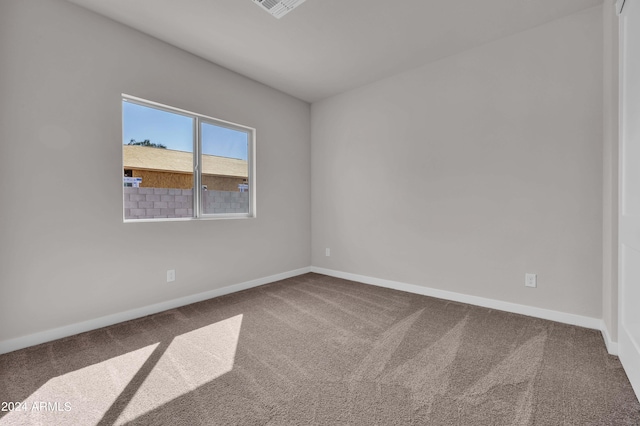 empty room with carpet flooring