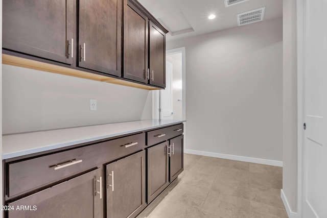 interior space featuring dark brown cabinets