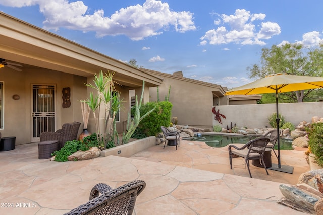 view of patio featuring a fenced in pool