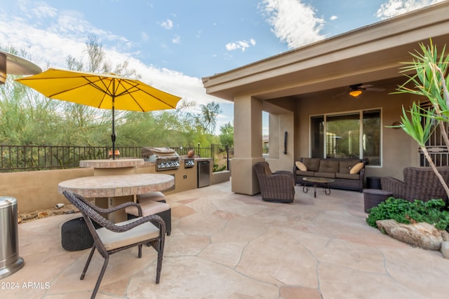 view of patio / terrace featuring ceiling fan, grilling area, and an outdoor hangout area