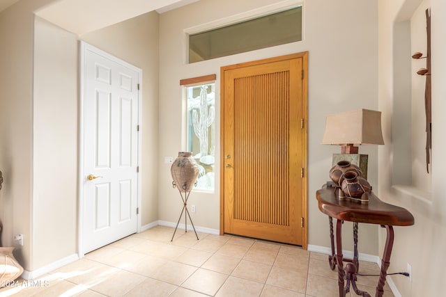 foyer entrance with light tile patterned flooring