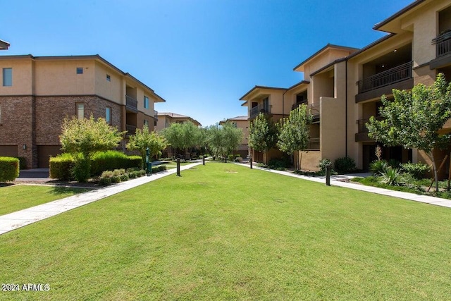 view of community featuring a lawn