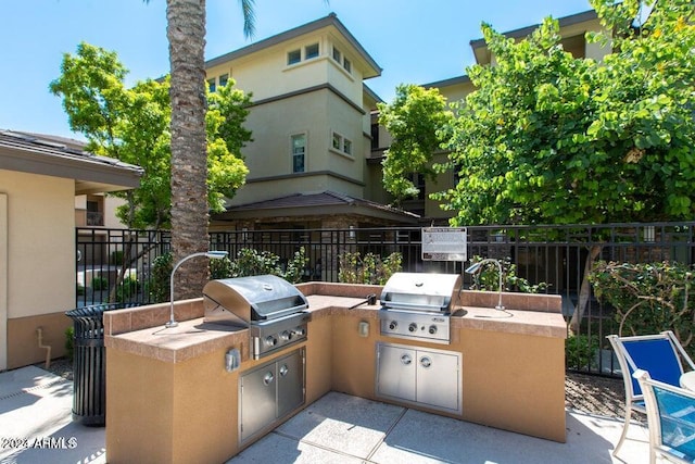 view of patio / terrace with sink, area for grilling, and grilling area