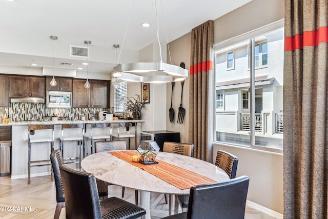 dining room with light parquet floors