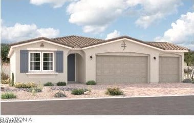 mediterranean / spanish home featuring a garage, driveway, a tiled roof, and stucco siding