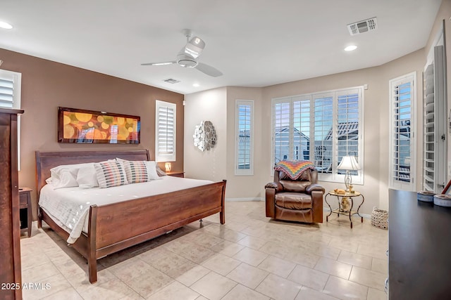 tiled bedroom featuring multiple windows and ceiling fan