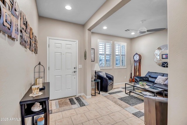 entryway with ceiling fan and light tile patterned floors