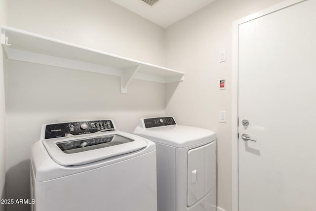 laundry room with washing machine and dryer and laundry area