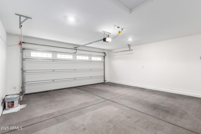 garage with baseboards and a garage door opener