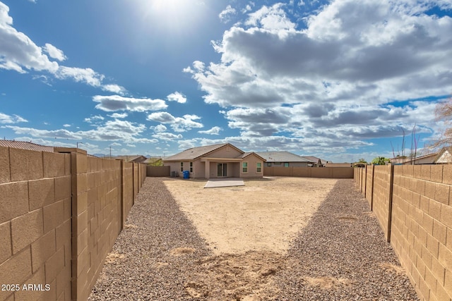 view of yard with a fenced backyard