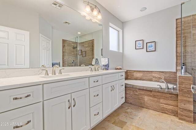 6847 S 27th Pl, Phoenix, AZ 85042 - bathroom with double vanity, a shower stall, and a bath