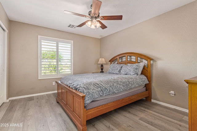 6847 S 27th Pl, Phoenix, AZ 85042 - bedroom featuring baseboards, light wood-style flooring, and a ceiling fan