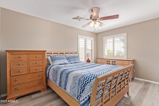 6847 S 27th Pl, Phoenix, AZ 85042 - bedroom featuring light wood finished floors, baseboards, and ceiling fan