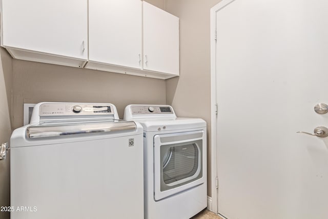 6847 S 27th Pl, Phoenix, AZ 85042 - laundry area featuring washing machine and dryer and cabinet space