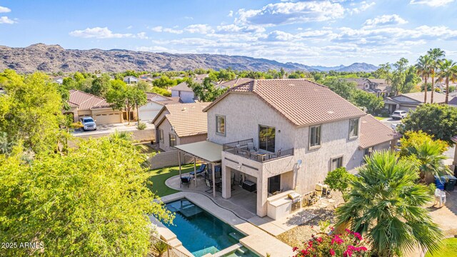 6847 S 27th Pl, Phoenix, AZ 85042 - rear view of property featuring a balcony, stucco siding, a mountain view, a tiled roof, and a patio area