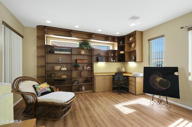 office area with baseboards, visible vents, built in study area, light wood-style flooring, and recessed lighting