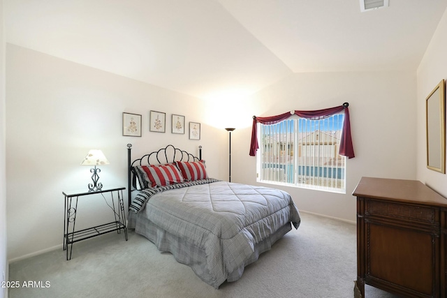 bedroom featuring visible vents, baseboards, carpet flooring, and vaulted ceiling