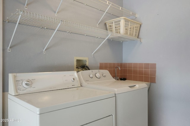 laundry area with laundry area and washer and dryer