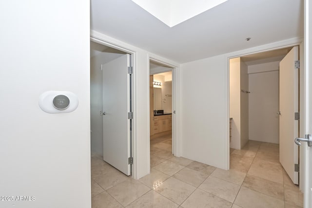 hall with light tile patterned flooring