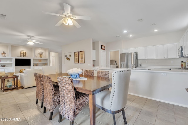 dining space featuring light tile patterned floors, built in shelves, visible vents, and recessed lighting