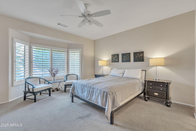 bedroom featuring a ceiling fan, baseboards, visible vents, and carpet flooring