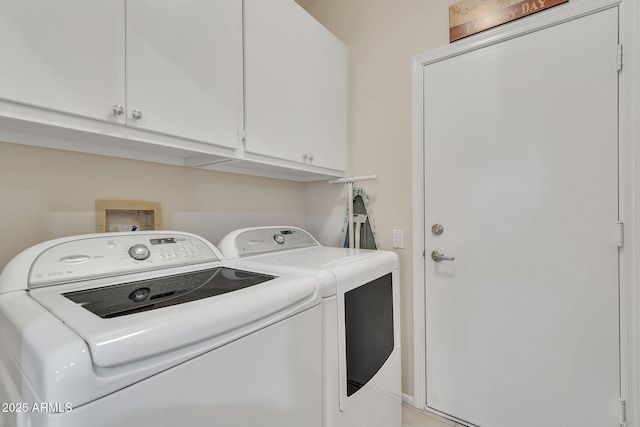 laundry room featuring cabinet space and independent washer and dryer