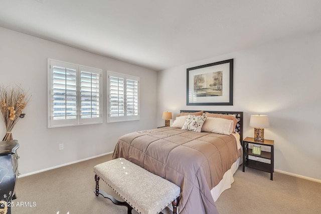 bedroom with carpet flooring and baseboards