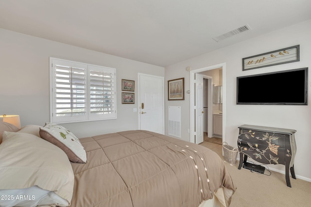 bedroom featuring carpet, connected bathroom, and visible vents