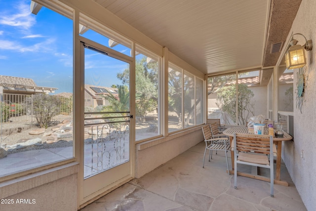 sunroom with plenty of natural light and visible vents