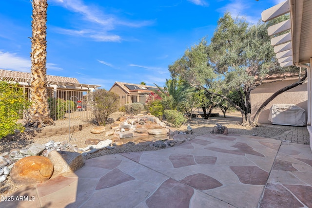 view of patio / terrace featuring fence