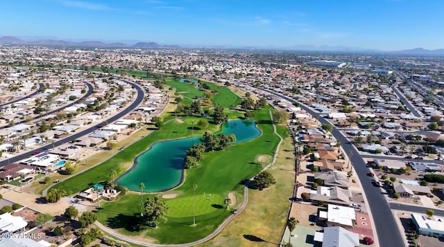 aerial view with a residential view, a water view, and golf course view