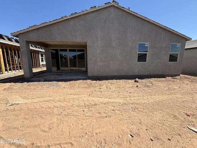 46868 W Old Timer Rd, Maricopa, AZ 85139 - back of house with stucco siding and a patio area