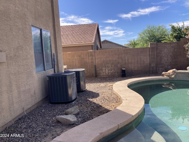 view of swimming pool featuring cooling unit