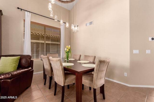 1453 E Elgin Pl, Chandler, AZ 85225 - tiled dining room featuring baseboards