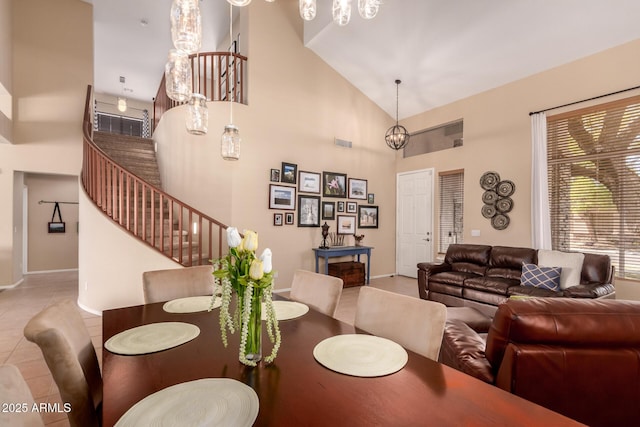 1453 E Elgin Pl, Chandler, AZ 85225 - tiled dining area featuring high vaulted ceiling, baseboards, and stairway