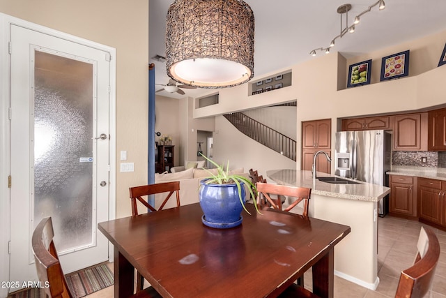 1453 E Elgin Pl, Chandler, AZ 85225 - dining room with a high ceiling, ceiling fan, stairway, and light tile patterned floors