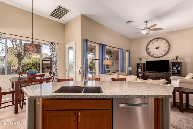 1453 E Elgin Pl, Chandler, AZ 85225 - kitchen with a sink, stainless steel dishwasher, open floor plan, light stone counters, and ceiling fan